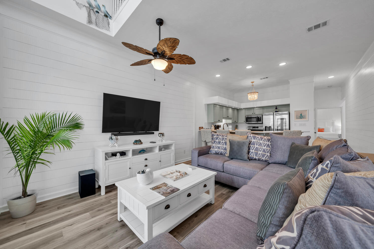 17878 Front Beach Road, Unit A1 Panama City Beach, FL 32413 - Photo 6 of 42 a living room with furniture and a flat screen tv