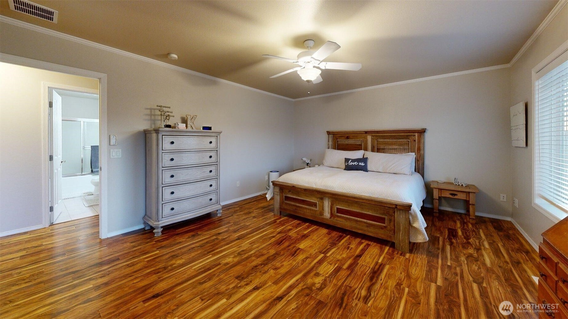 1724 Ridgeview Drive Clarkston, WA 99403 - Photo 29 of 38 a bedroom with a bed and wooden floor