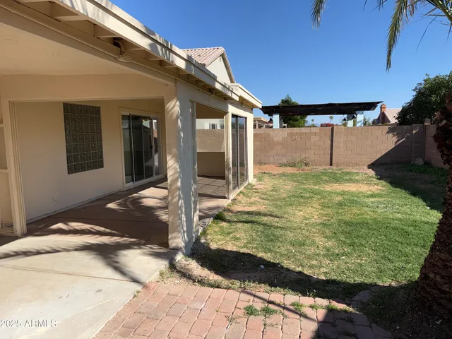 a view of a backyard of the house