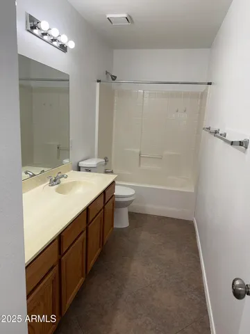 a bathroom with a double vanity sink mirror and shower