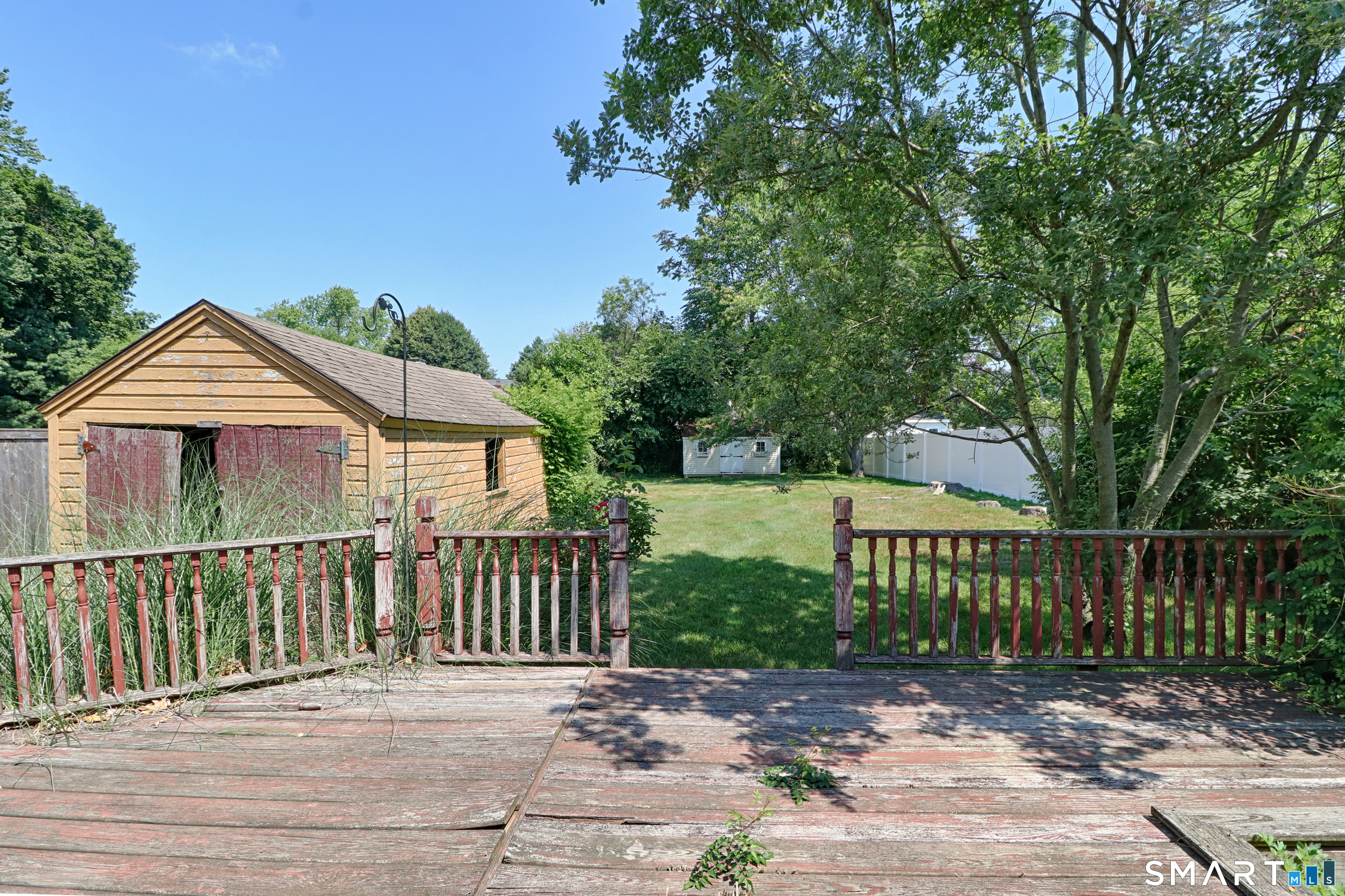 104 Henderson Road Fairfield, CT 06824 - Photo 24 of 26 This is the view of the large deep backyard from the deck. There is plenty of room for swing sets, patios, firepits and amazing barbecues!
