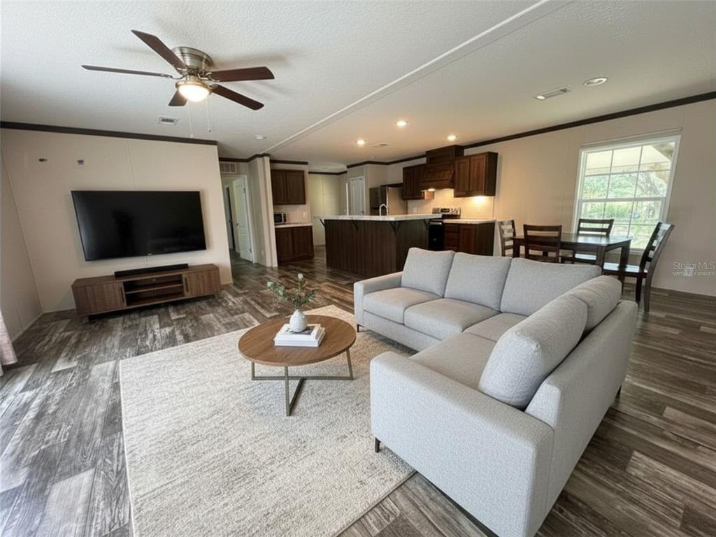 9827 Southeast Hoth Road Arcadia, FL 34266 - Photo 13 of 28 a living room with furniture and a flat screen tv