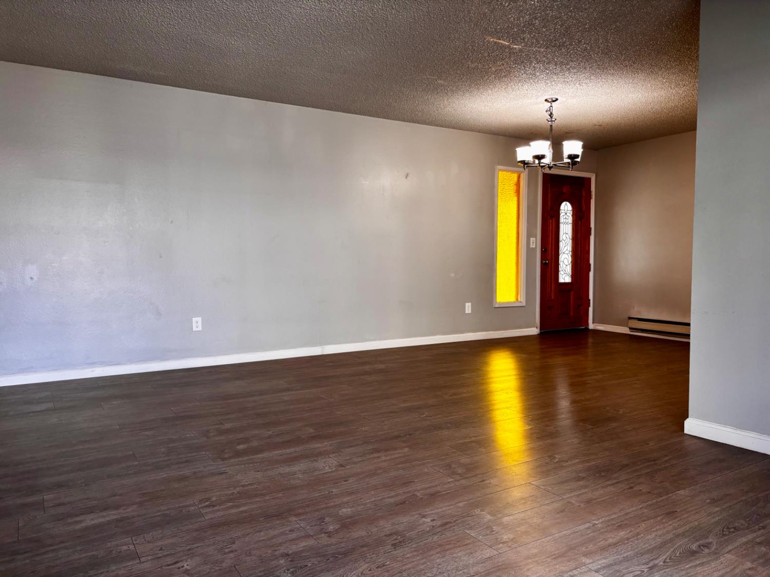 111 Patterson Avenue Loyalton, CA 96118 - Photo 16 of 46 wooden floor in an empty room with a window