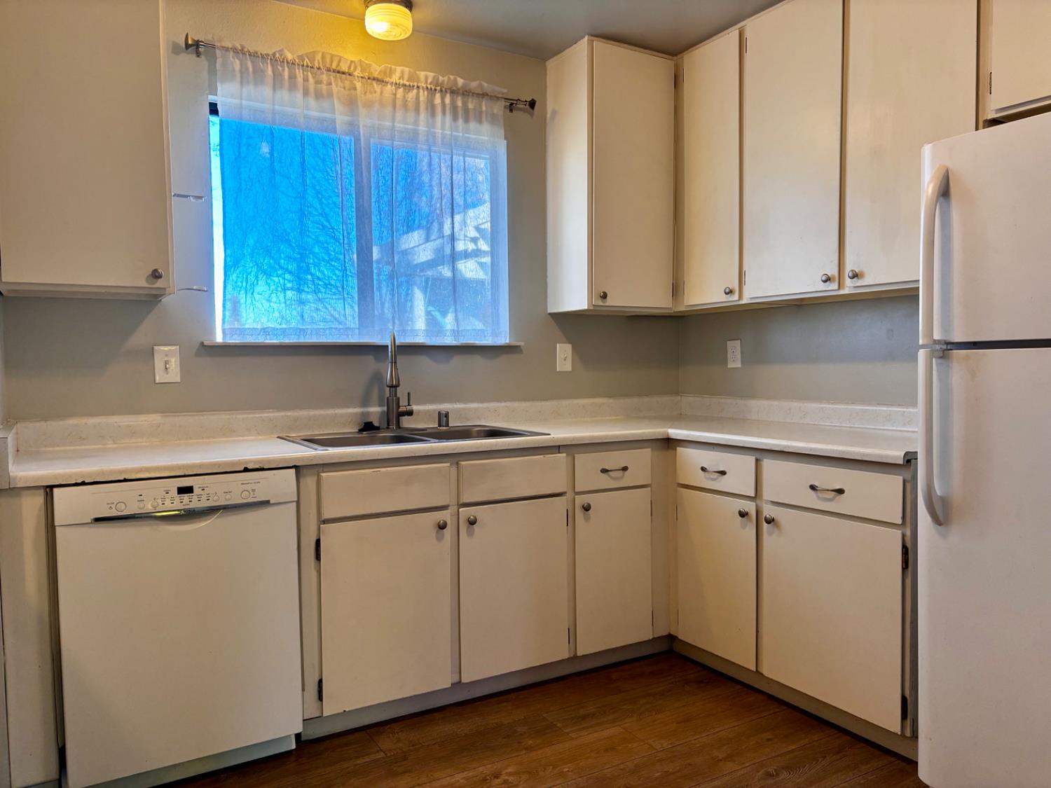 111 Patterson Avenue Loyalton, CA 96118 - Photo 18 of 45 a kitchen with appliances cabinets and a sink