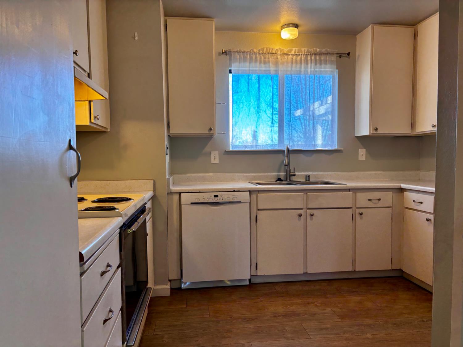 111 Patterson Avenue Loyalton, CA 96118 - Photo 18 of 46 a kitchen with a sink cabinets and appliances