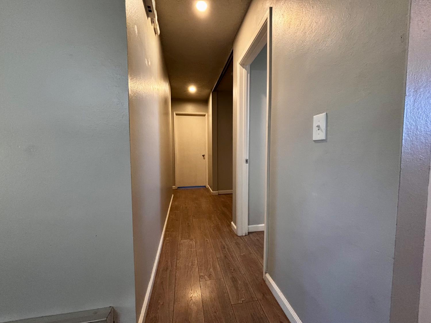 111 Patterson Avenue Loyalton, CA 96118 - Photo 24 of 46 a view of a hallway with wooden floor