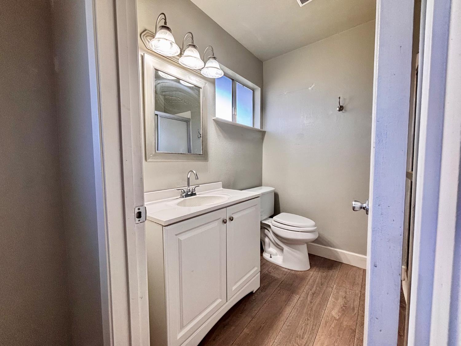 111 Patterson Avenue Loyalton, CA 96118 - Photo 29 of 46 a bathroom with a toilet sink and mirror