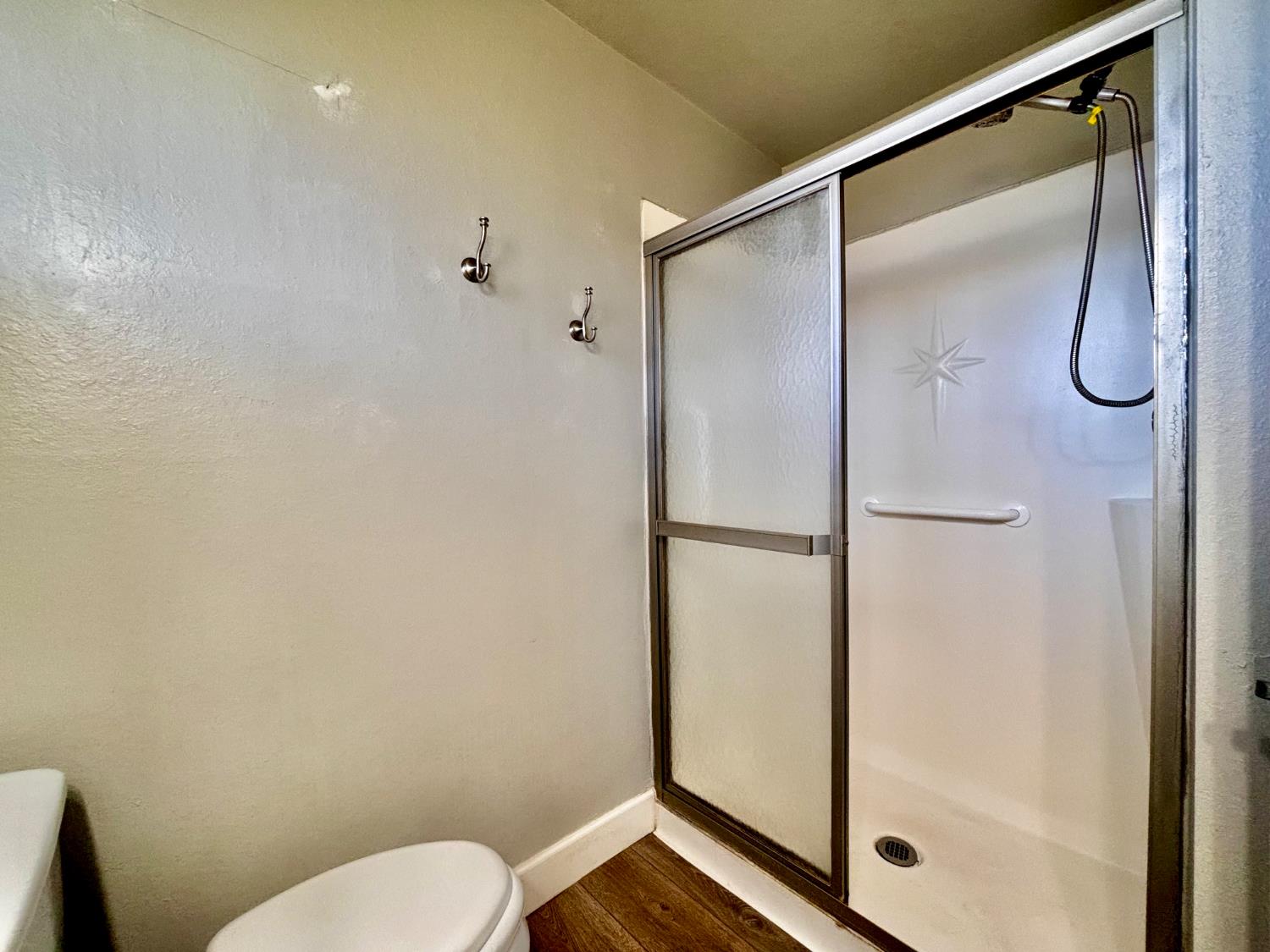 111 Patterson Avenue Loyalton, CA 96118 - Photo 30 of 46 a bathroom with a shower and toilet