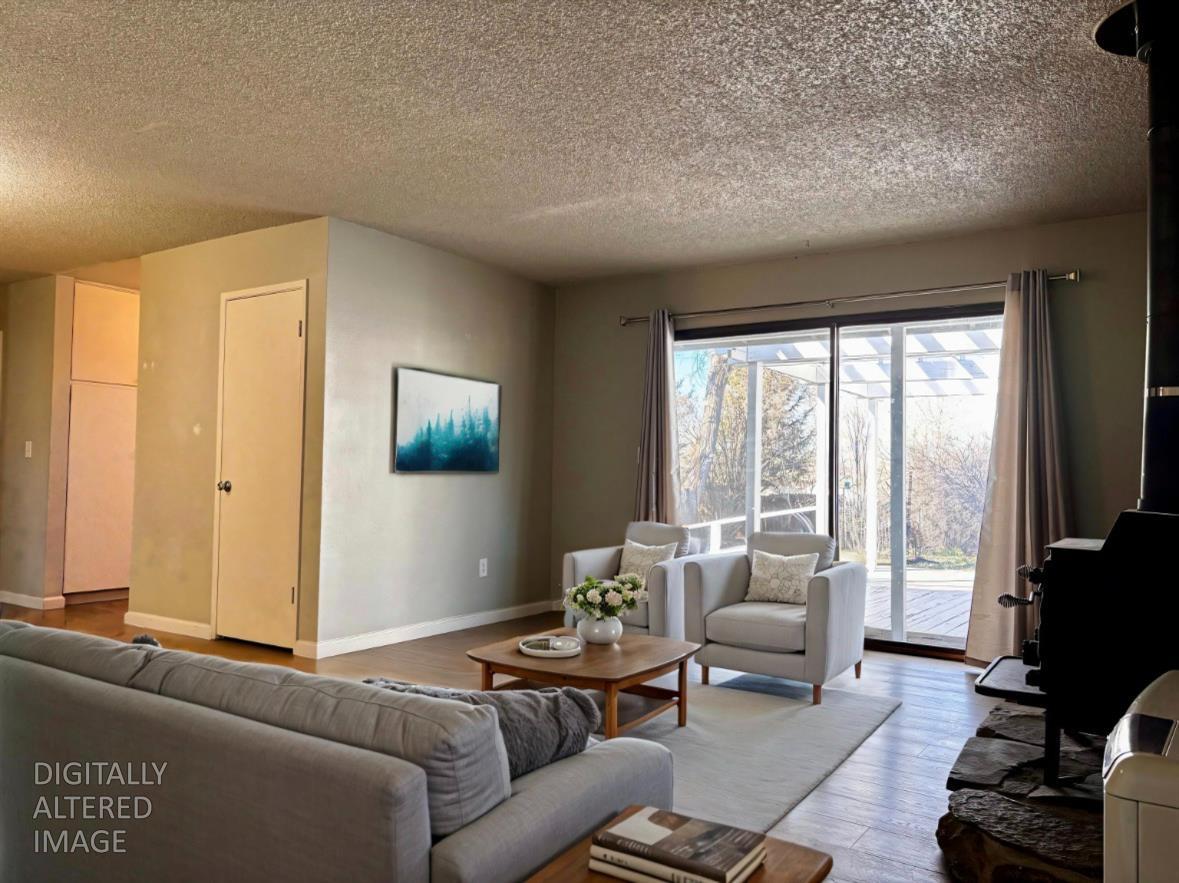 111 Patterson Avenue Loyalton, CA 96118 - Photo 8 of 45 a living room with furniture and a flat screen tv