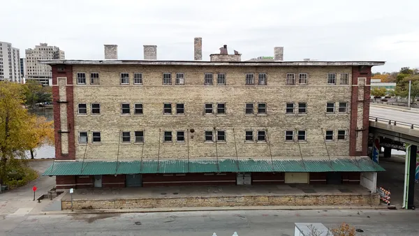 a view of a large building with a bench