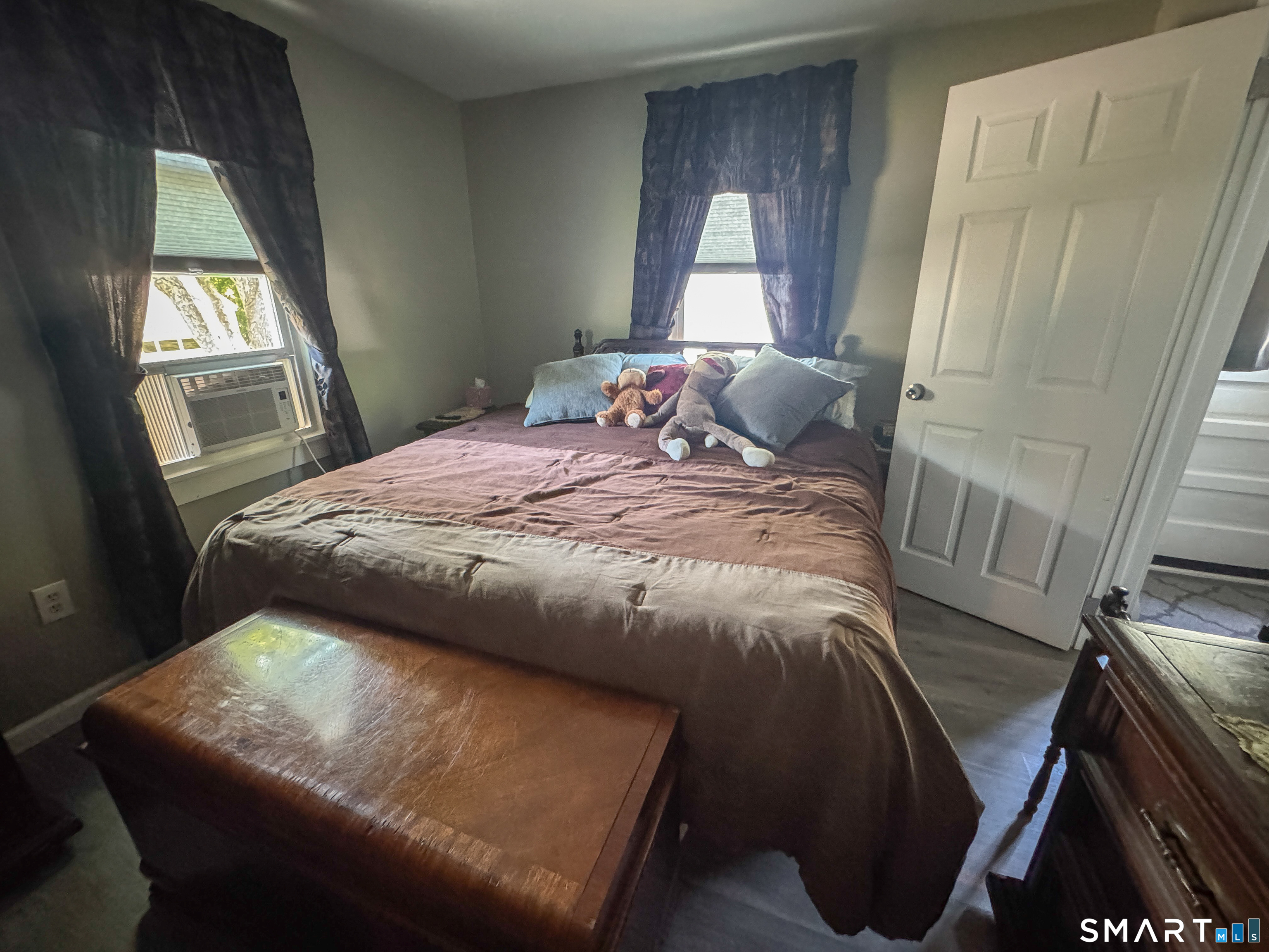 36 Jennings Street Norwich, CT 06360 - Photo 25 of 33 a bedroom with a bed and wooden floor