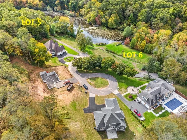 an aerial view of residential house with outdoor space and swimming pool