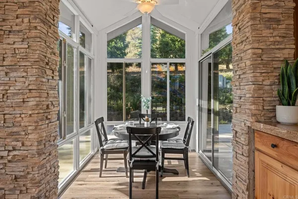 a kitchen with stainless steel appliances granite countertop a stove a sink dishwasher and cabinets with wooden floor