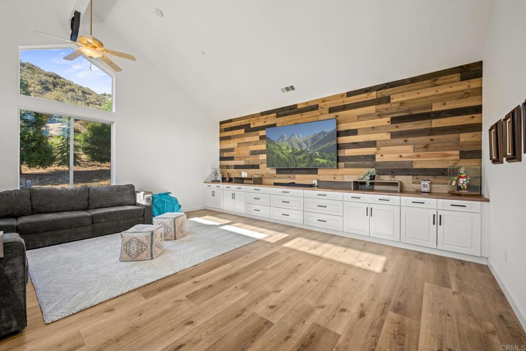 26380 San Felipe Road Warner Springs, CA 92086 - Photo 35 of 69 a living room with furniture and a flat screen tv