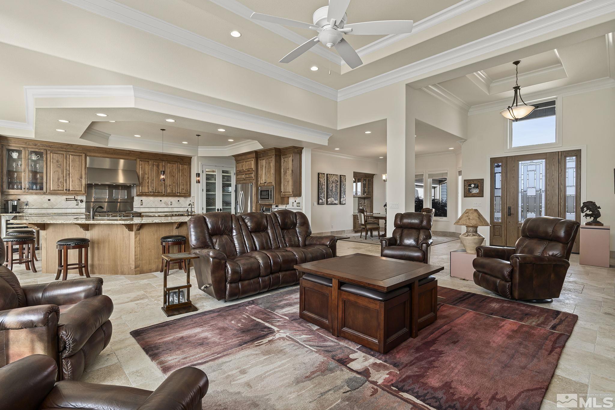 345 James Canyon Loop Genoa, NV 89411 - Photo 14 of 40 a living room with furniture kitchen view and a chandelier