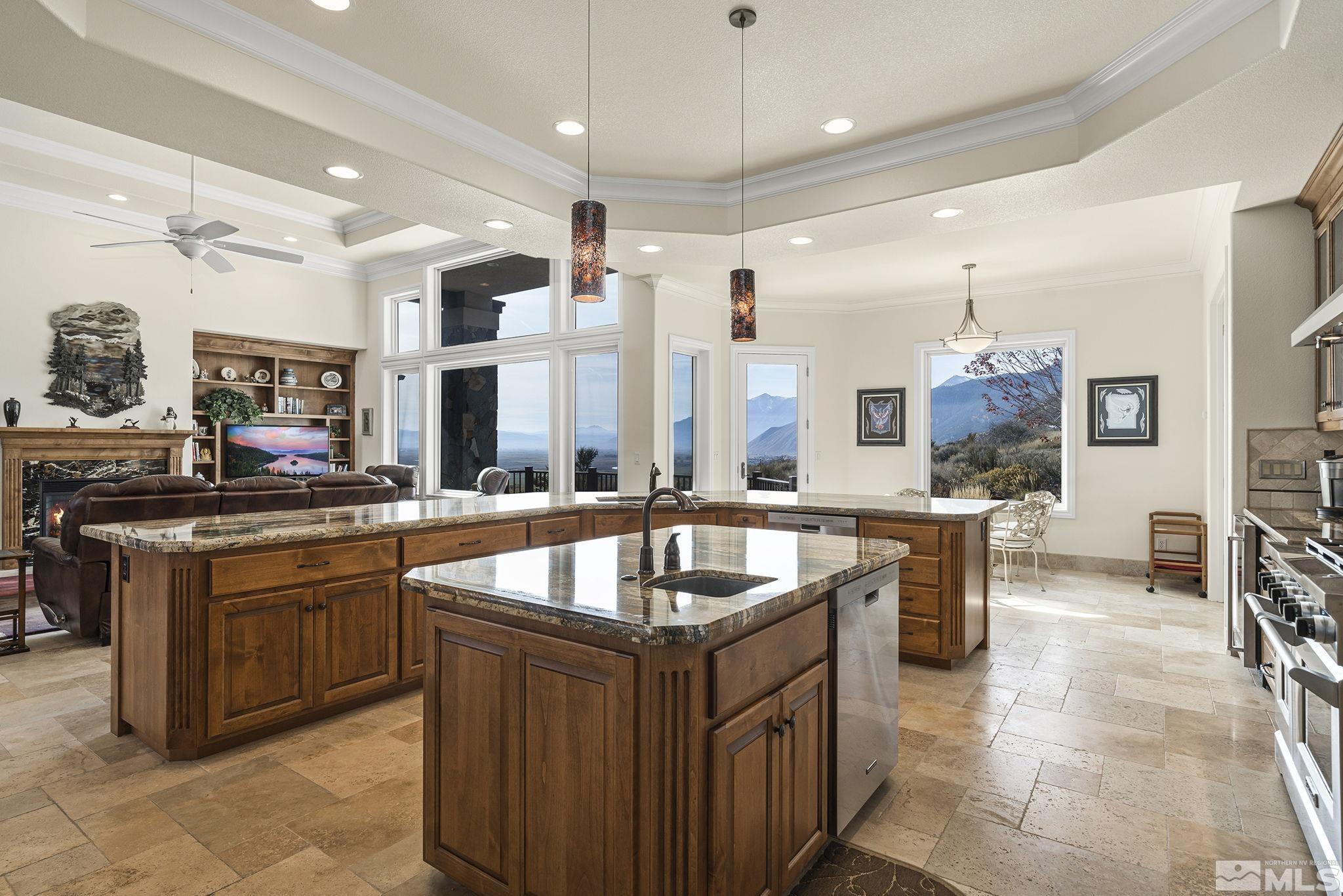 345 James Canyon Loop Genoa, NV 89411 - Photo 20 of 40 a kitchen with granite countertop a sink and a refrigerator
