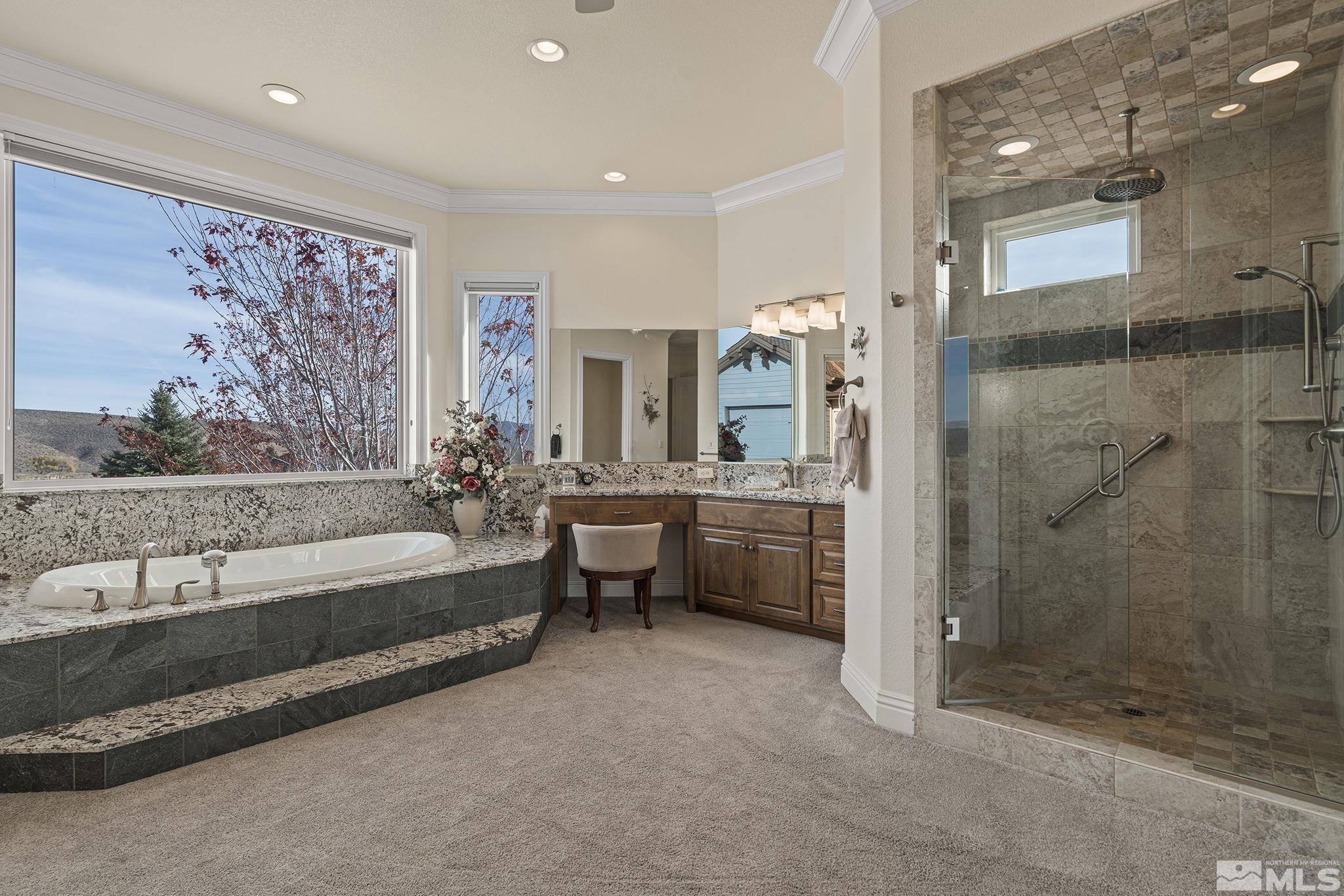 345 James Canyon Loop Genoa, NV 89411 - Photo 25 of 40 a bathroom with a bathtub and a shower