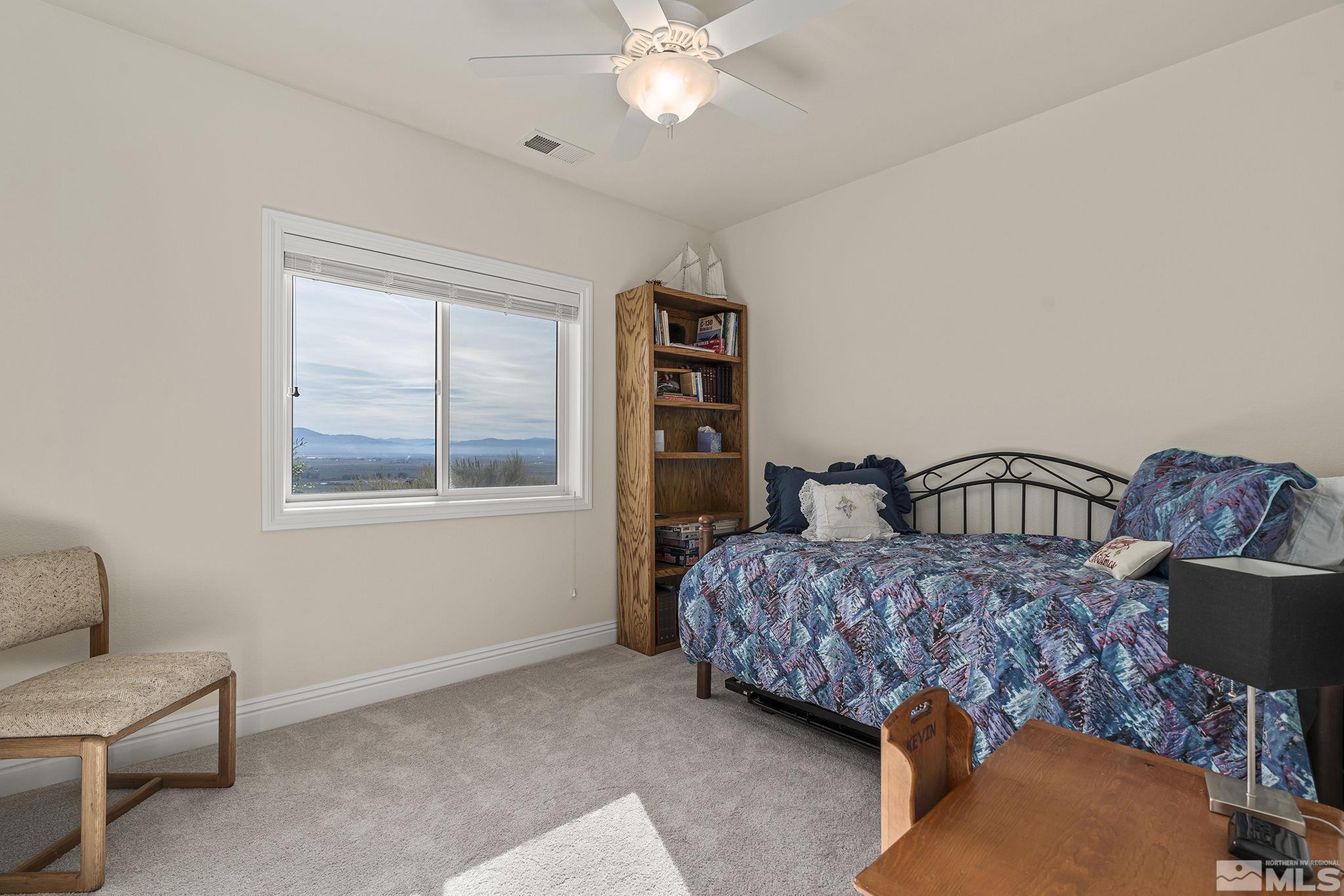 345 James Canyon Loop Genoa, NV 89411 - Photo 31 of 40 a bedroom with bed and a window