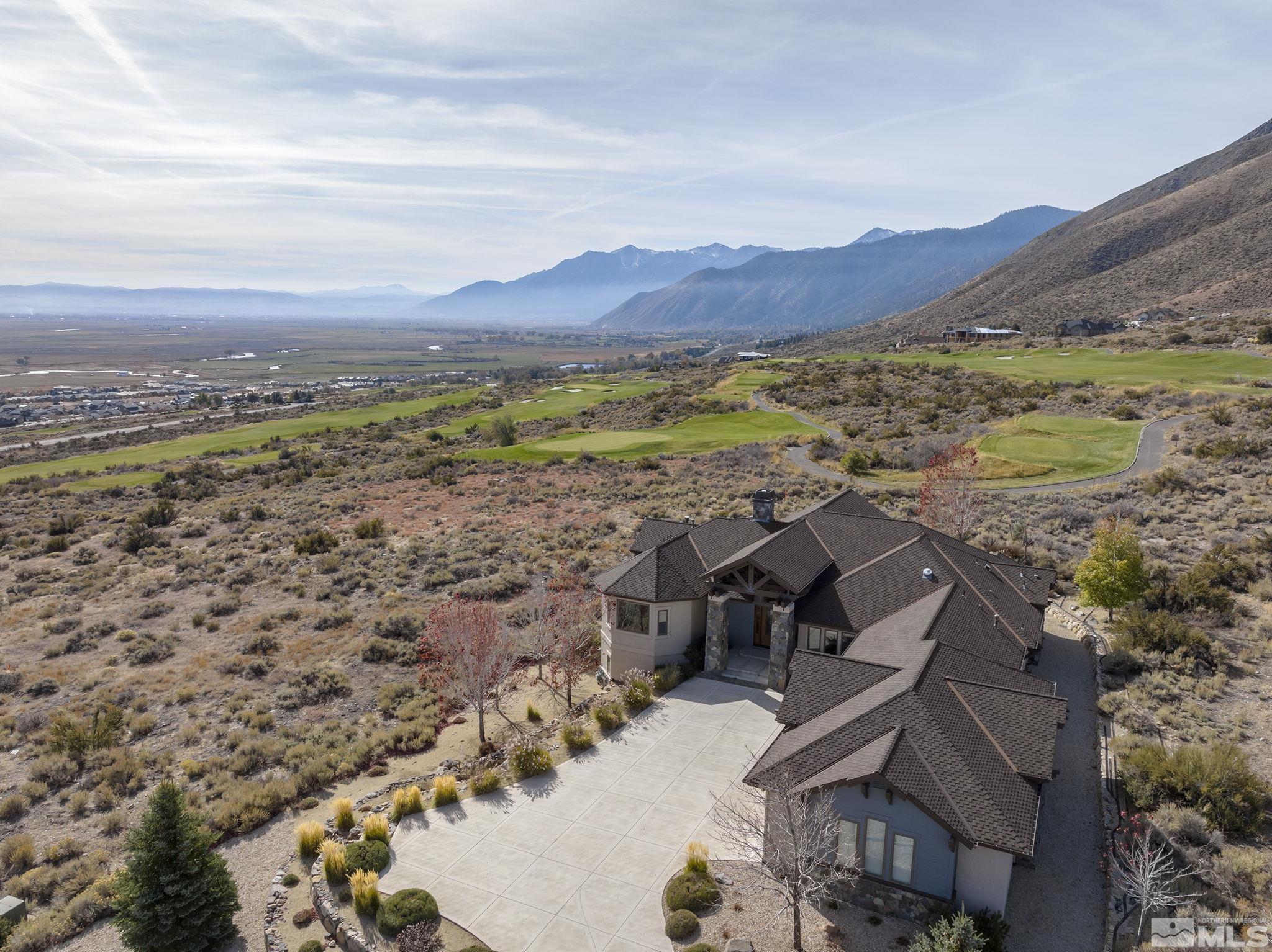 345 James Canyon Loop Genoa, NV 89411 - Photo 38 of 40 aerial view of a house with a mountain