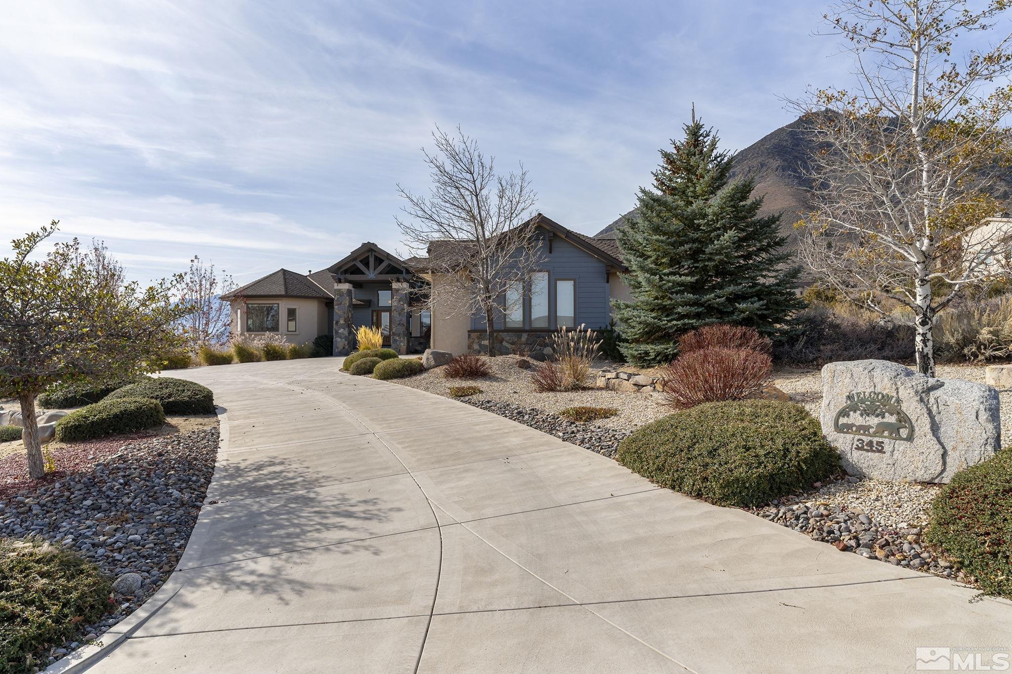 345 James Canyon Loop Genoa, NV 89411 - Photo 4 of 40 a view of a house with a snow in a yard