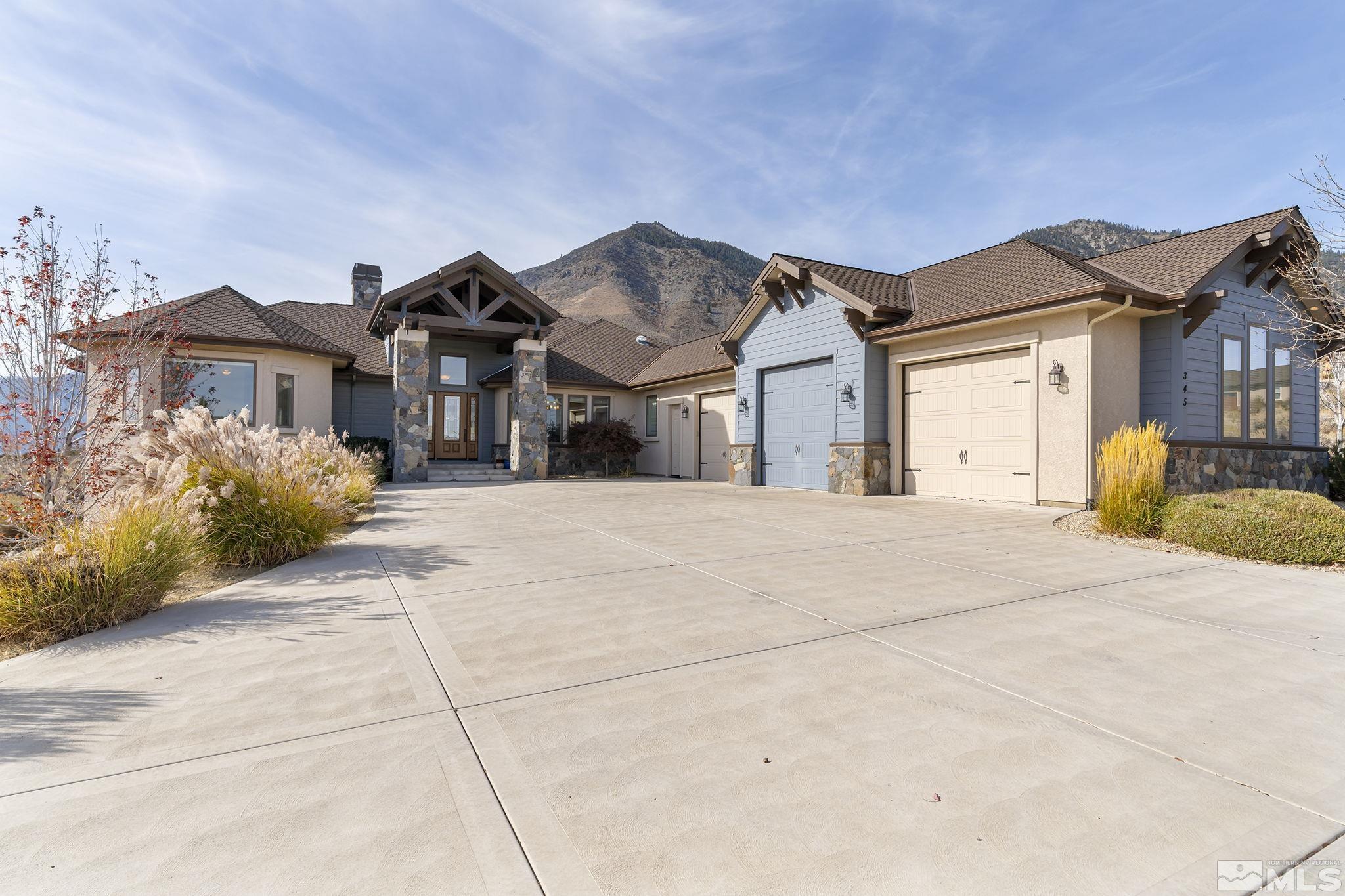 345 James Canyon Loop Genoa, NV 89411 - Photo 6 of 40 a front view of a house with a yard