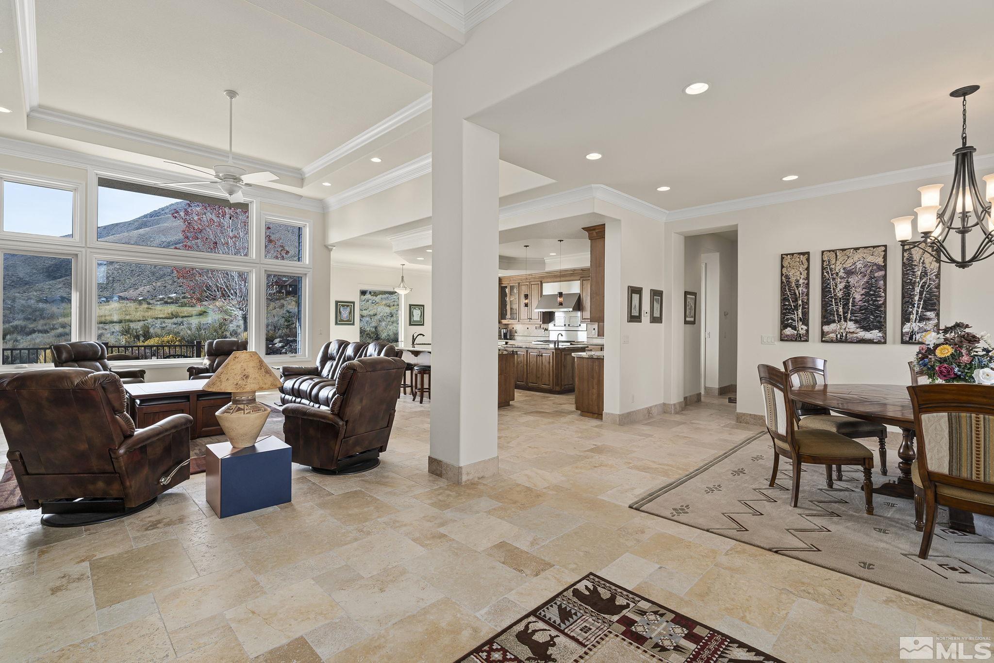 345 James Canyon Loop Genoa, NV 89411 - Photo 9 of 40 a living room with furniture large window and a view of dining table