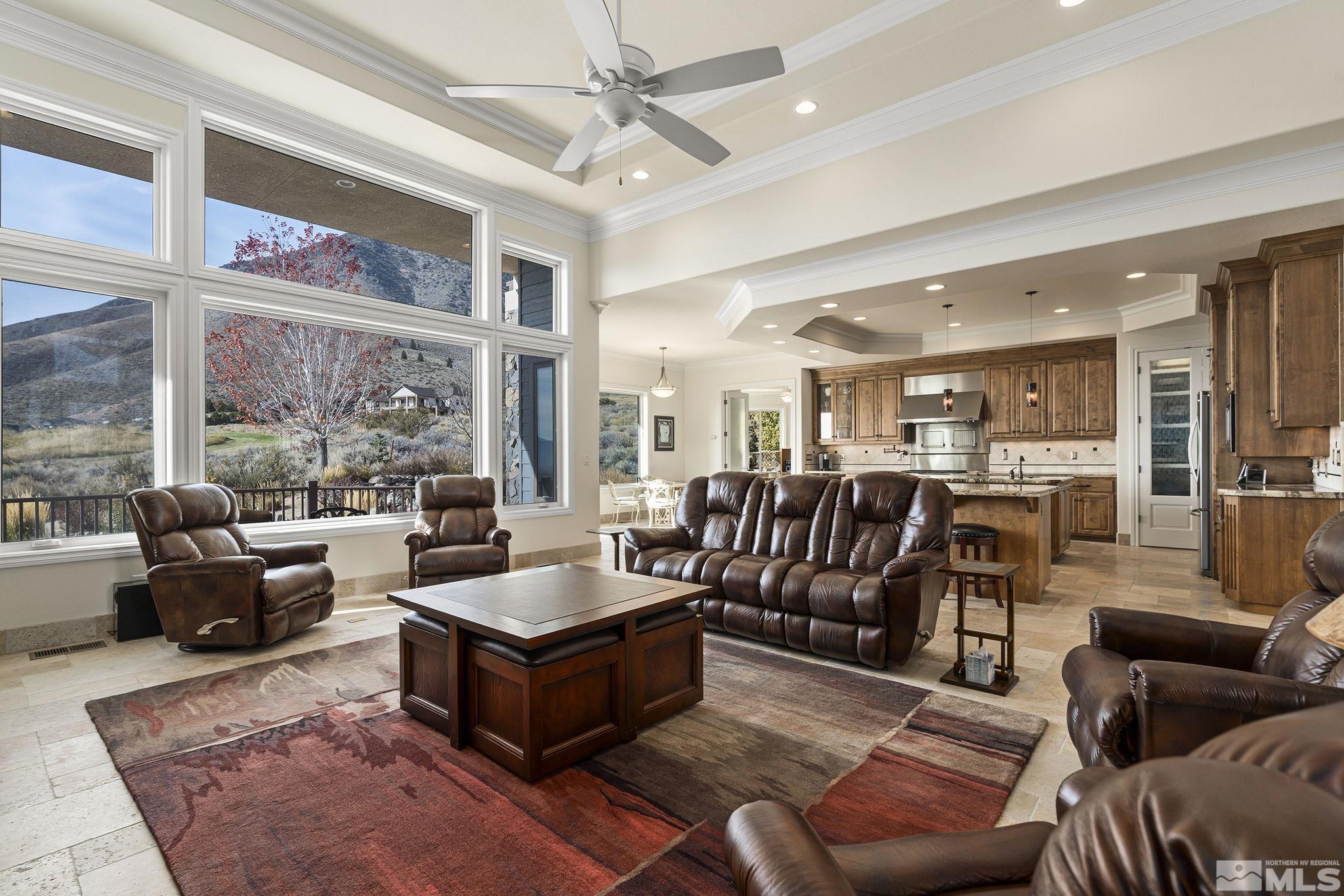 345 James Canyon Loop Genoa, NV 89411 - Photo 10 of 40 a living room with furniture ceiling fan and a rug