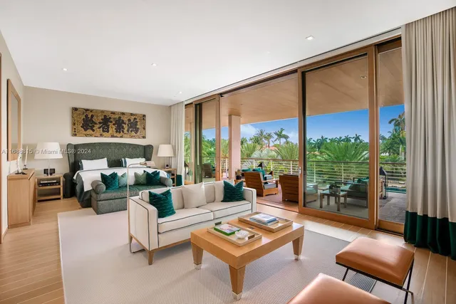 a living room with furniture city view and large windows