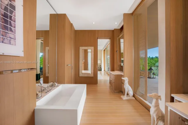 a spacious bathroom with a bathtub and a sink