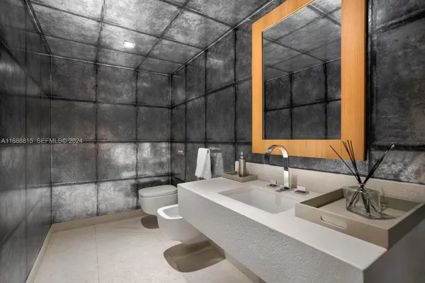 a view of a roof deck with couches and sky view