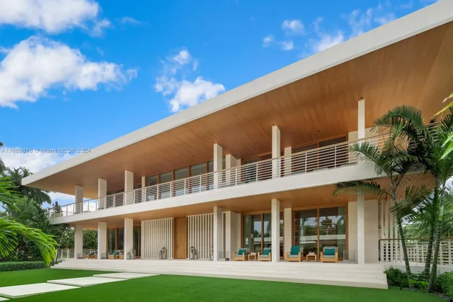 a front view of a building with a garden