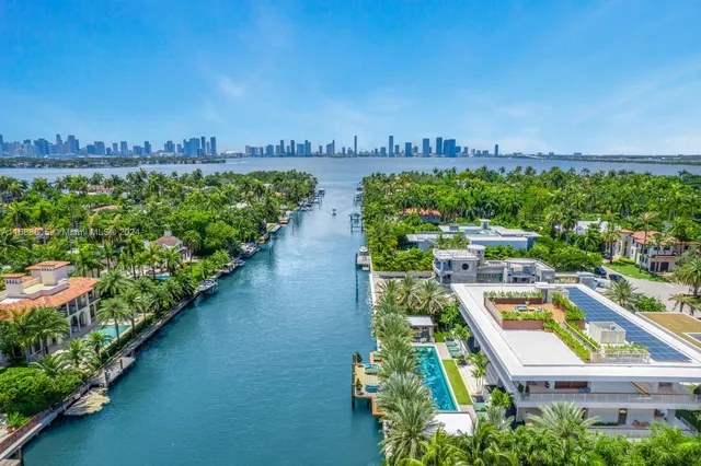 a view of a city with lots of residential buildings and ocean view