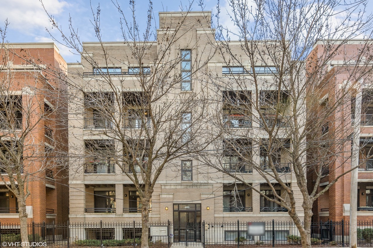 a large building with a tree in front