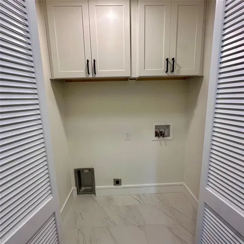 a view of storage and utility room in wooden floor