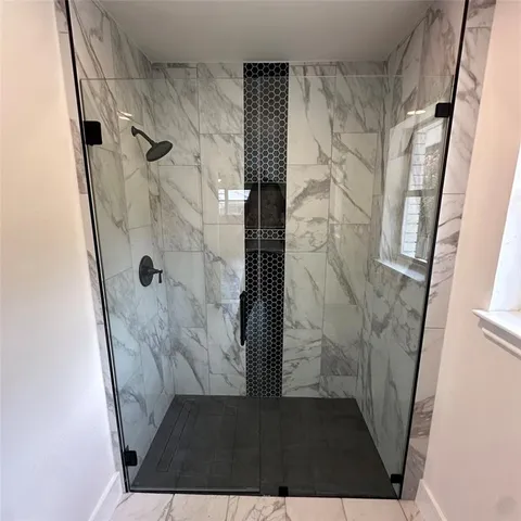 a bathroom with a double vanity sink and mirror