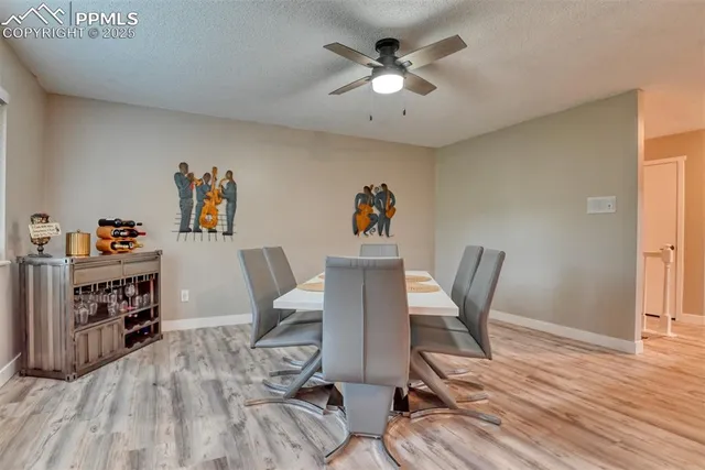 a view of a workspace with furniture and wooden floor