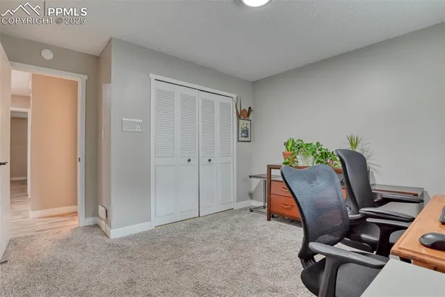 a workspace with furniture and a gate