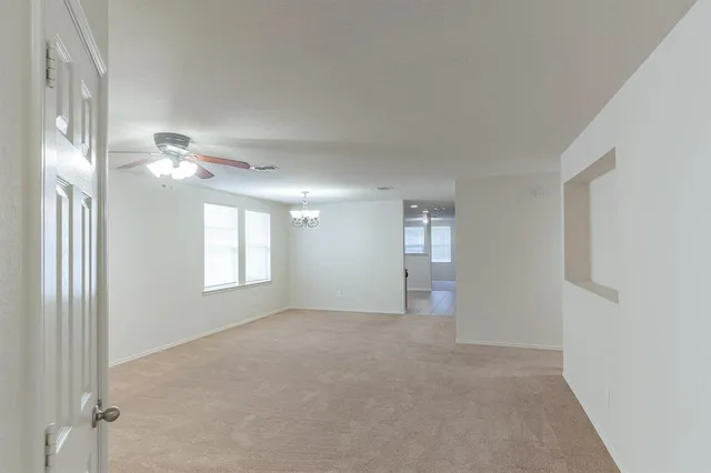 a view of an empty room with a window