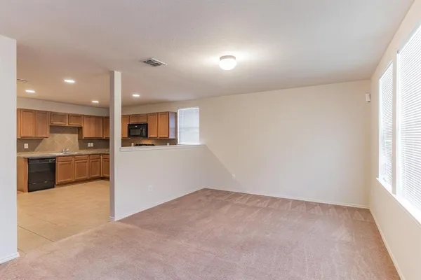 a view of a kitchen with a sink and a microwave