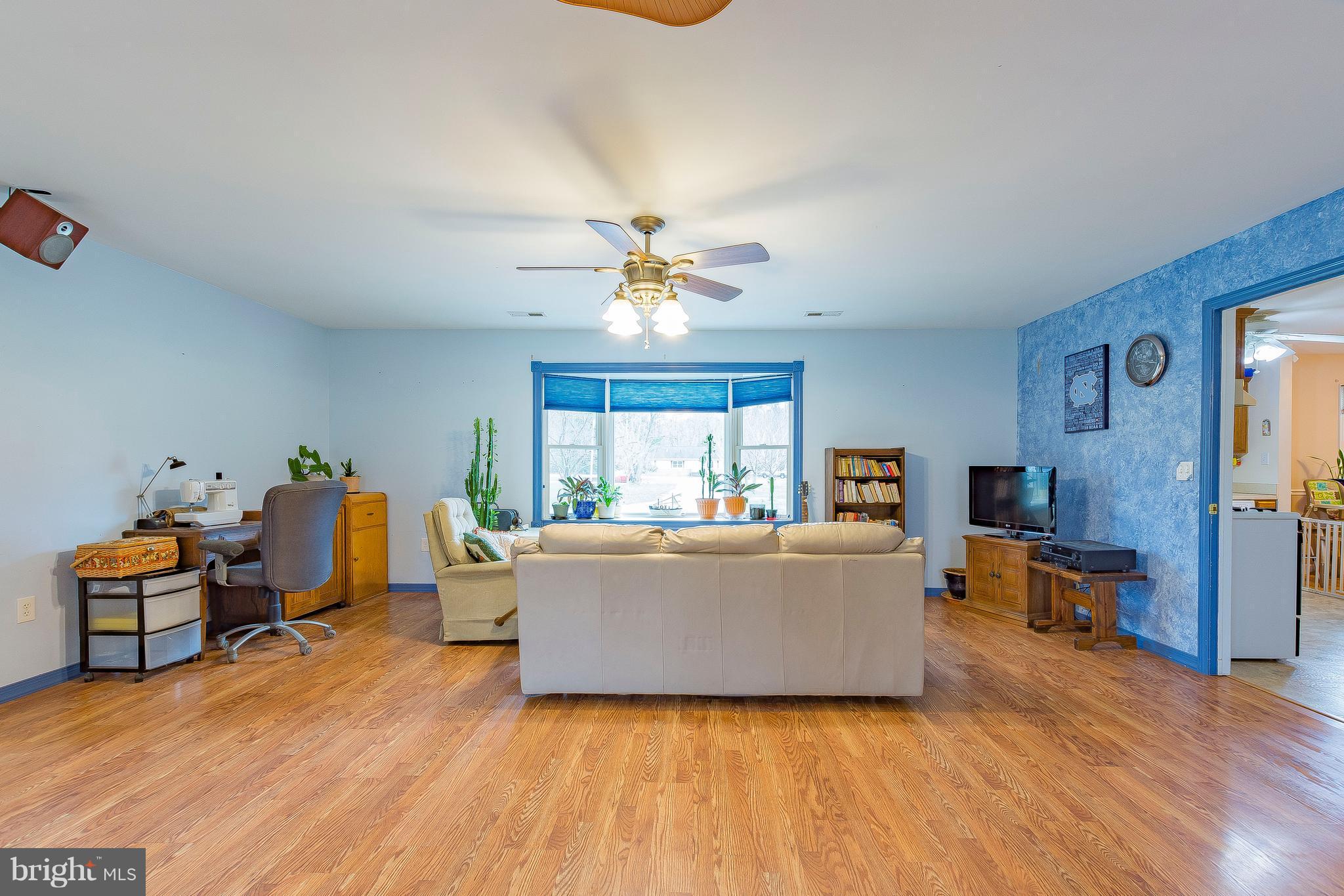 3181 Carroll Road Huntingtown, MD 20639 - Photo 11 of 28 a living room with furniture and a wooden floor