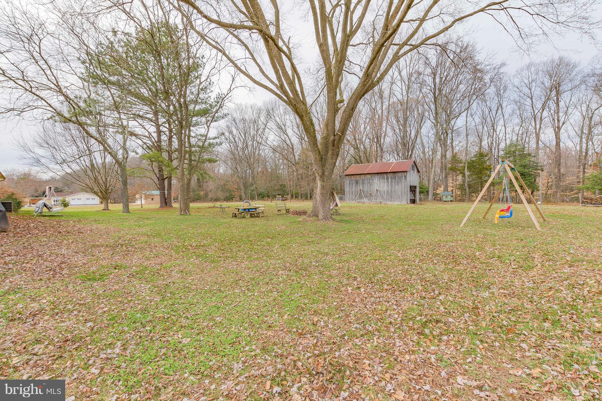 3181 Carroll Road Huntingtown, MD 20639 - Photo 3 of 28 a view of a playground with a tree