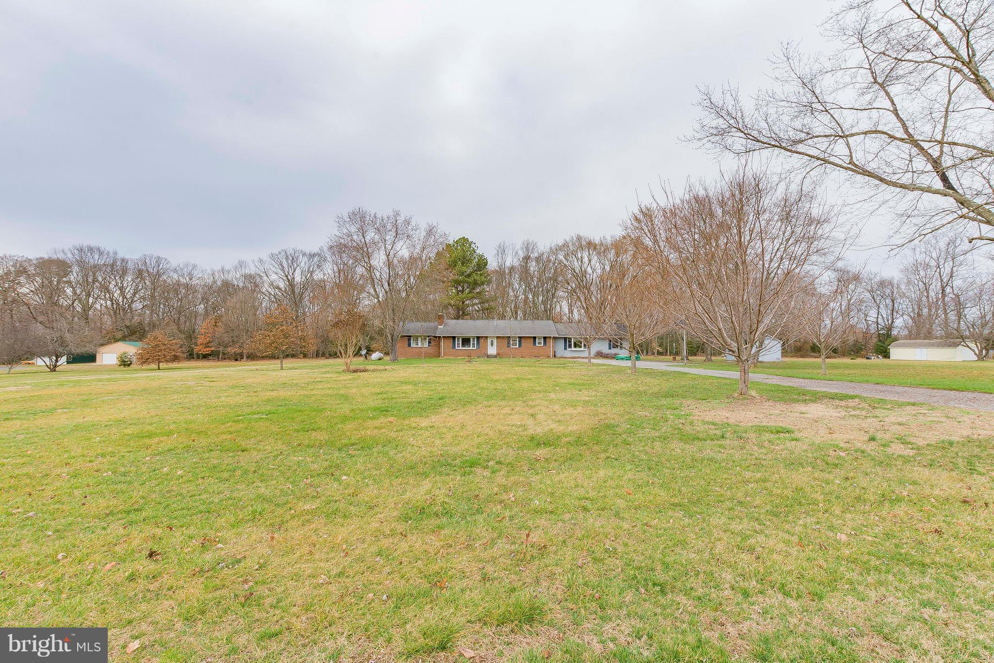 3181 Carroll Road Huntingtown, MD 20639 - Photo 25 of 28 a view of a field with trees in the background