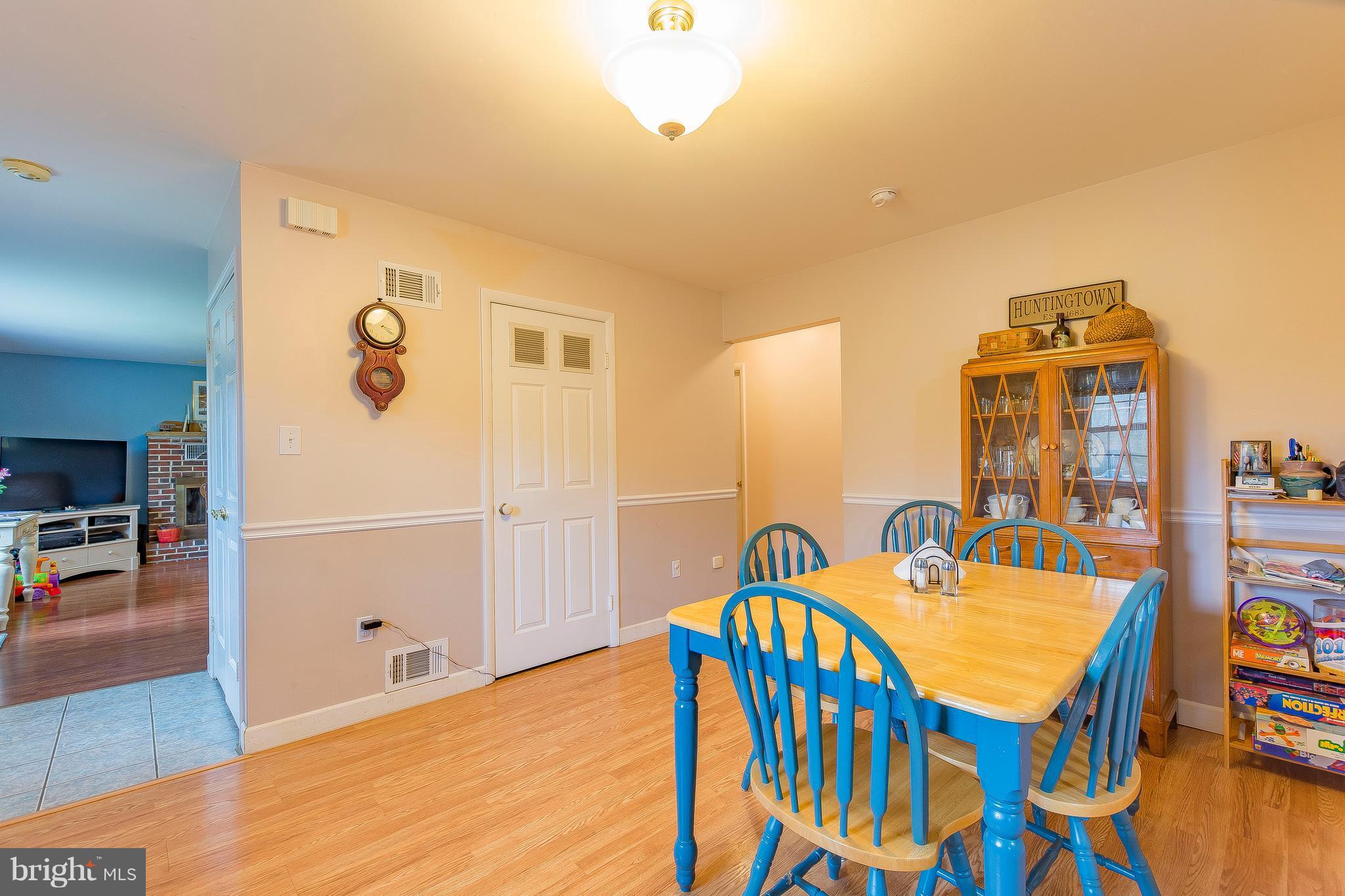3181 Carroll Road Huntingtown, MD 20639 - Photo 9 of 28 a view of a dining room with furniture and wooden floor