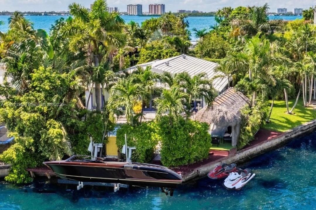 a backyard with a table and chairs