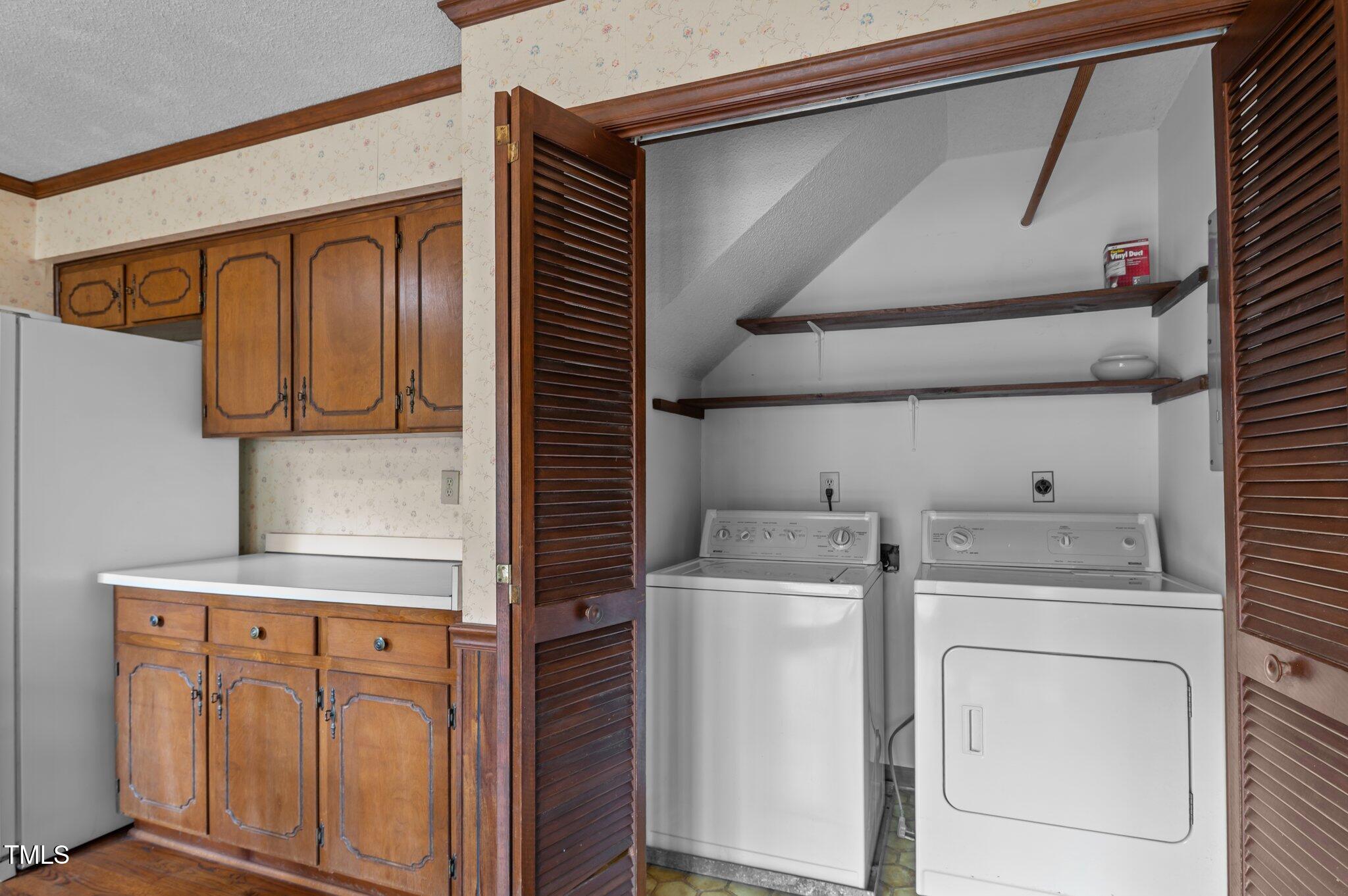 8404 Sleepy Creek Drive Raleigh, NC 27613 - Photo 13 of 39 a utility room with dryer and washer