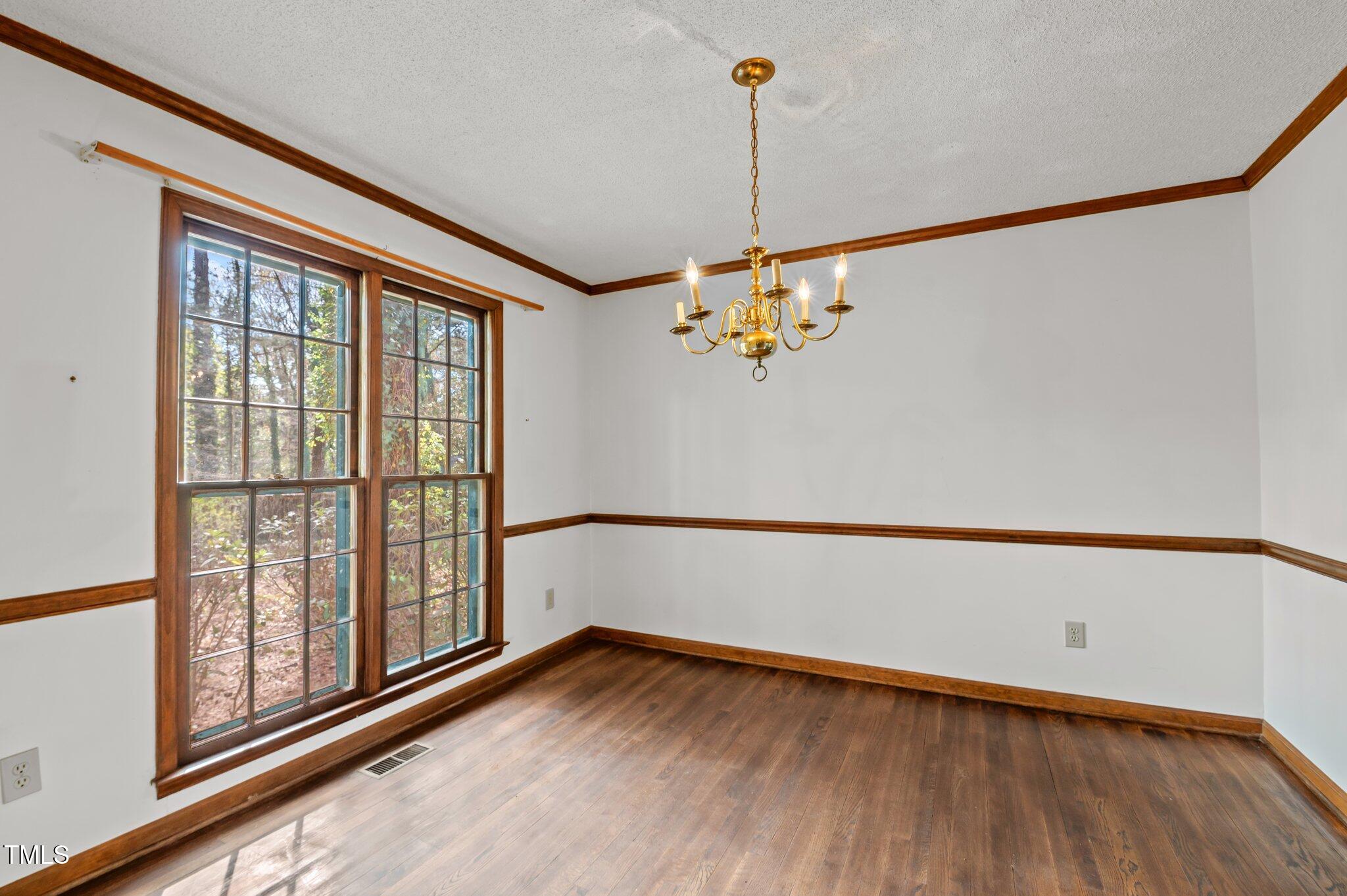 8404 Sleepy Creek Drive Raleigh, NC 27613 - Photo 15 of 39 a view of an empty room with a window
