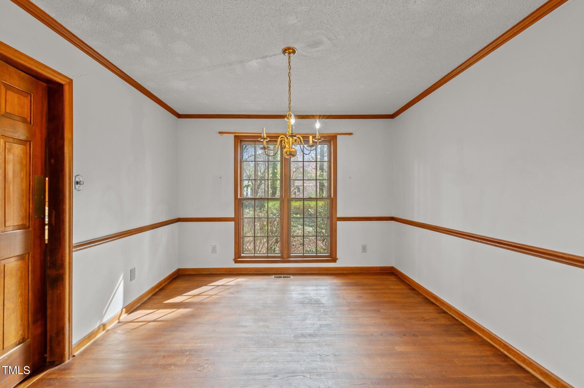 8404 Sleepy Creek Drive Raleigh, NC 27613 - Photo 16 of 39 a view of an empty room with a window