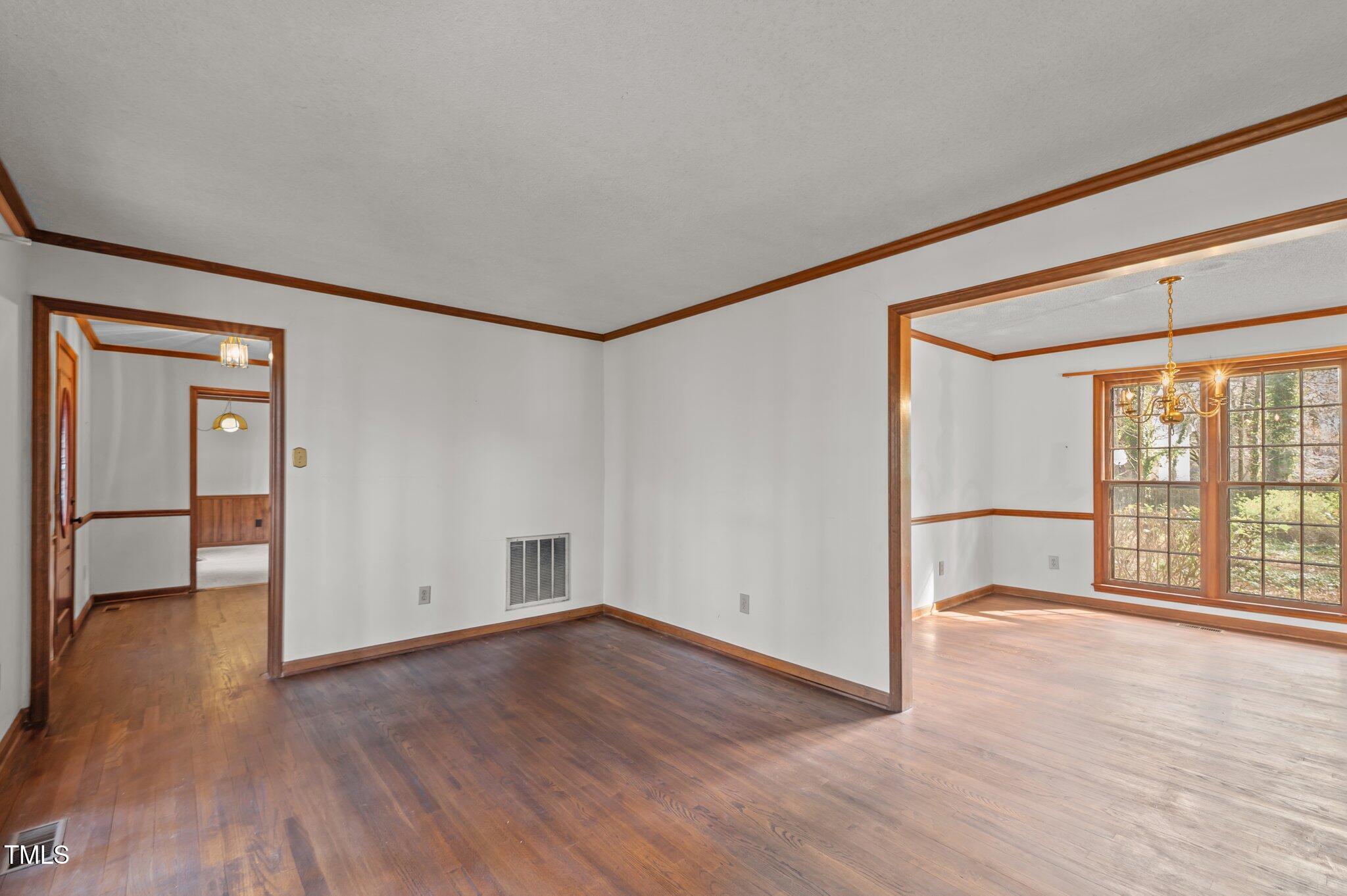 8404 Sleepy Creek Drive Raleigh, NC 27613 - Photo 19 of 39 wooden floor in an empty room with a window