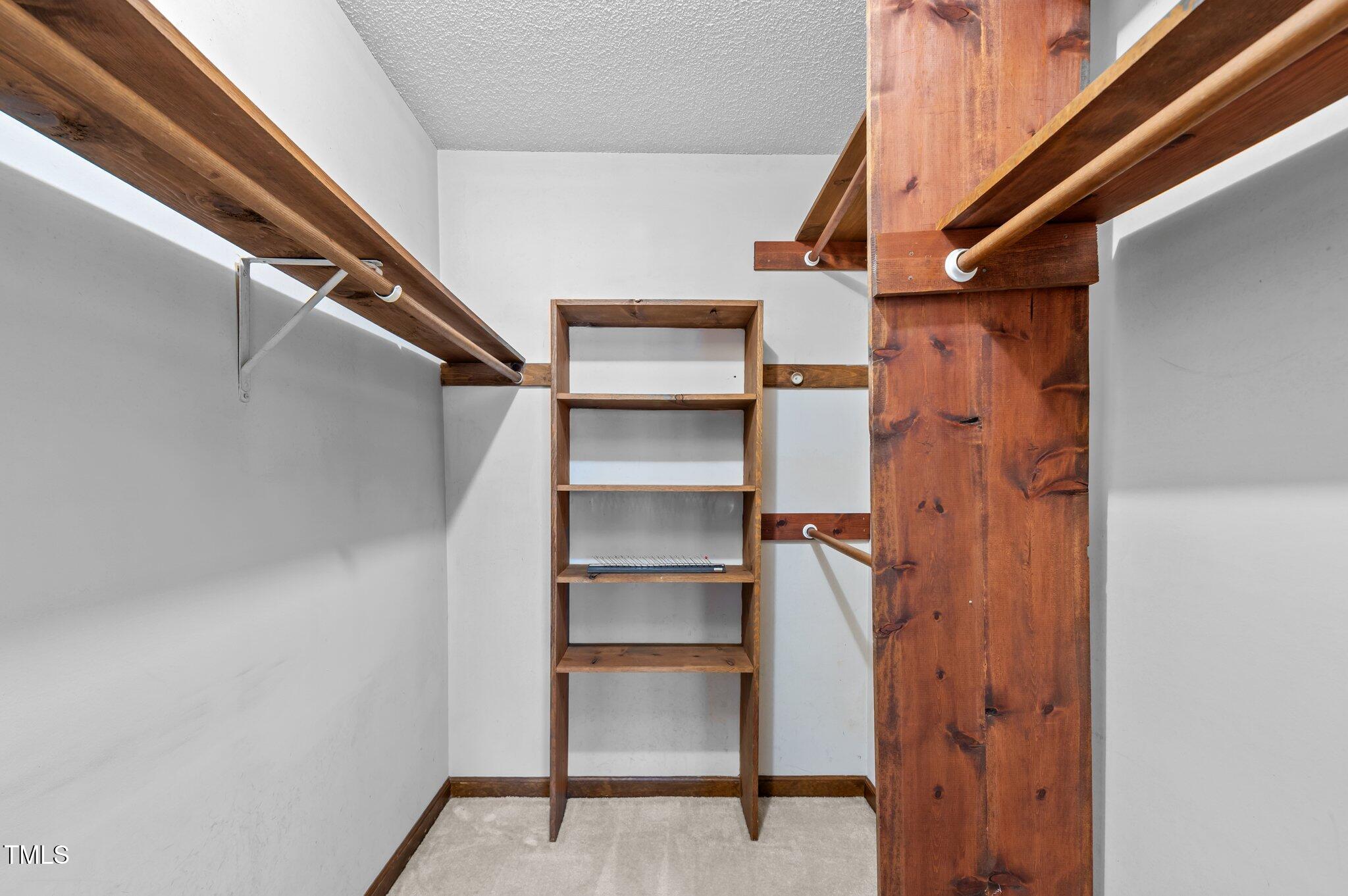 8404 Sleepy Creek Drive Raleigh, NC 27613 - Photo 22 of 39 a view of walk in closet