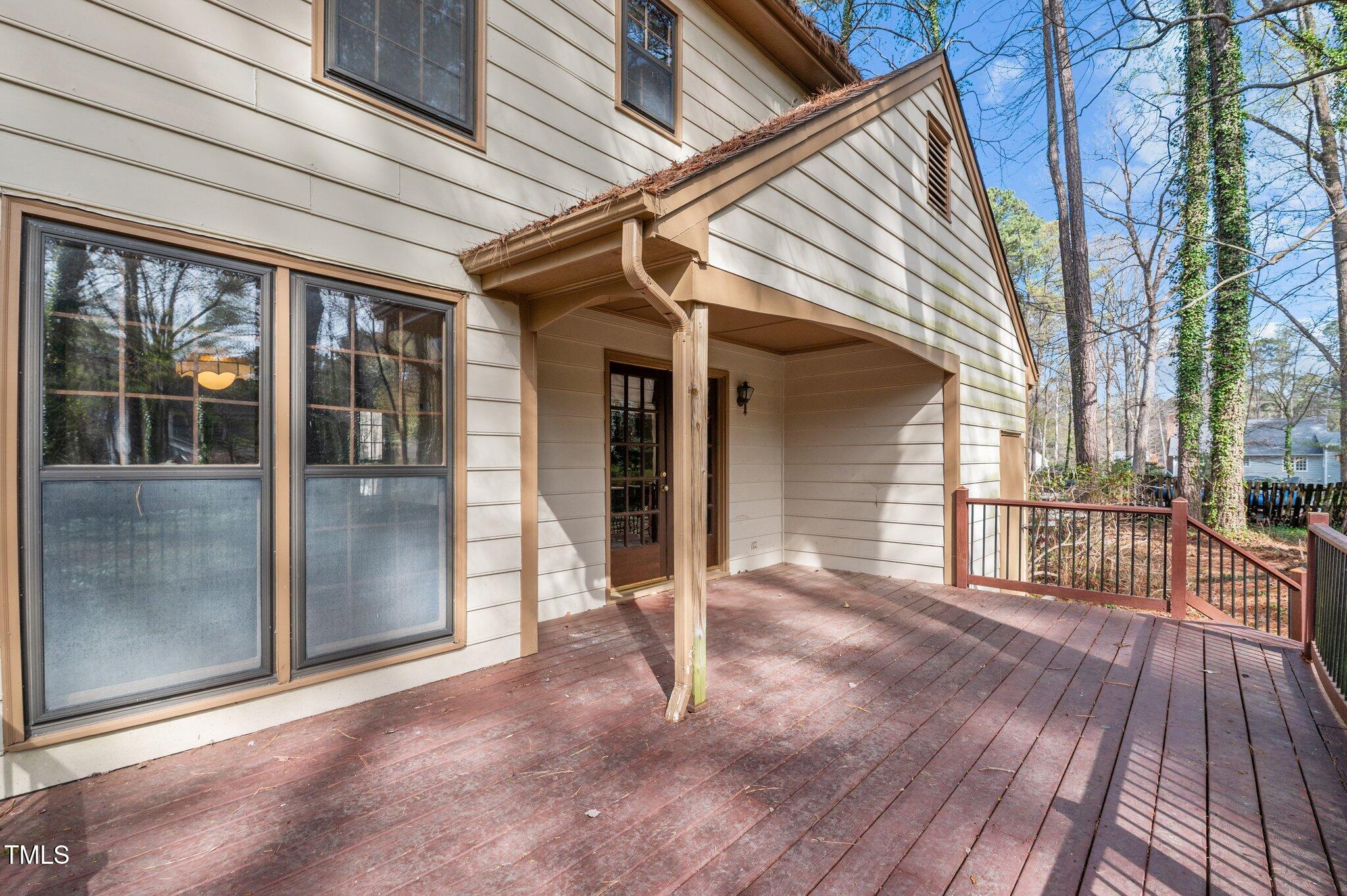 8404 Sleepy Creek Drive Raleigh, NC 27613 - Photo 34 of 39 a view of a house with porch and wooden floor